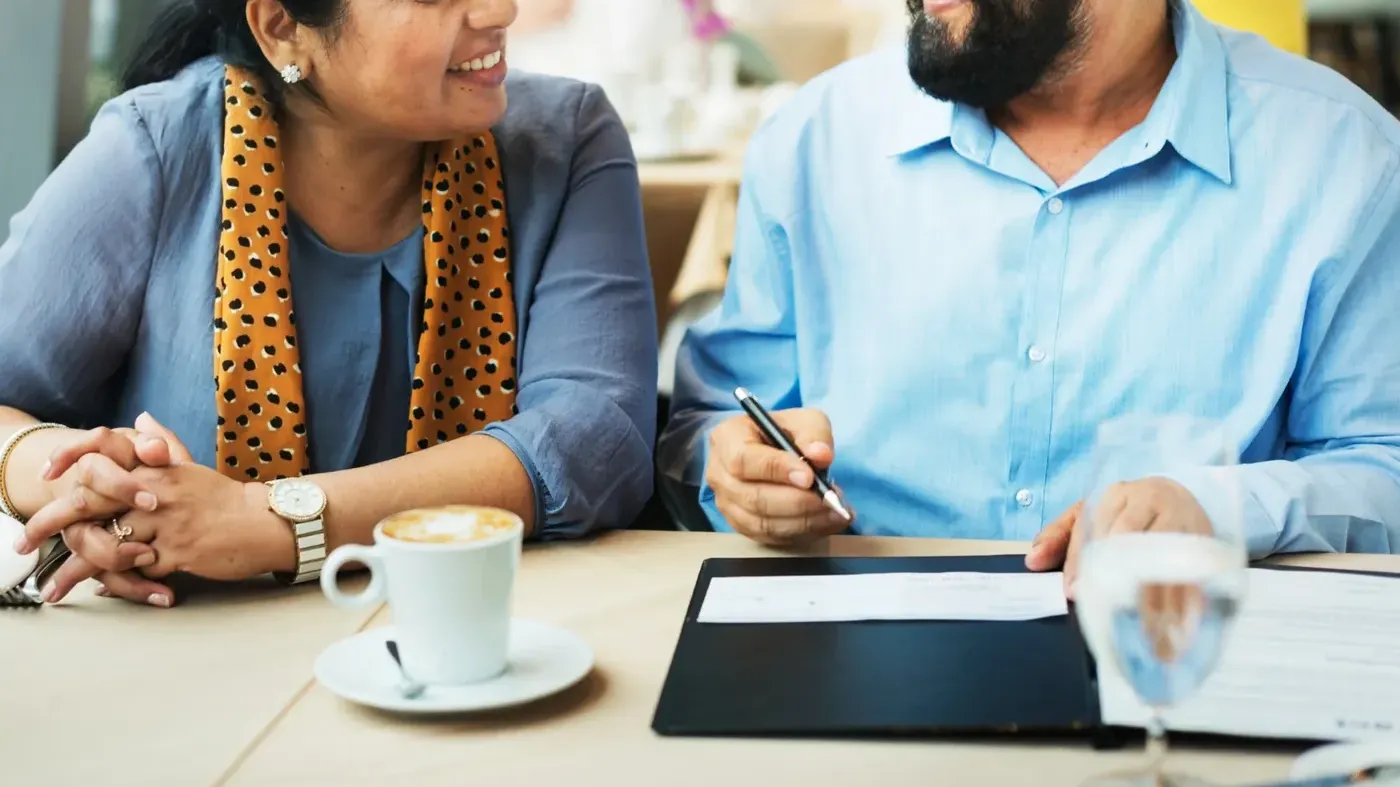 man and woman meeting over coffee