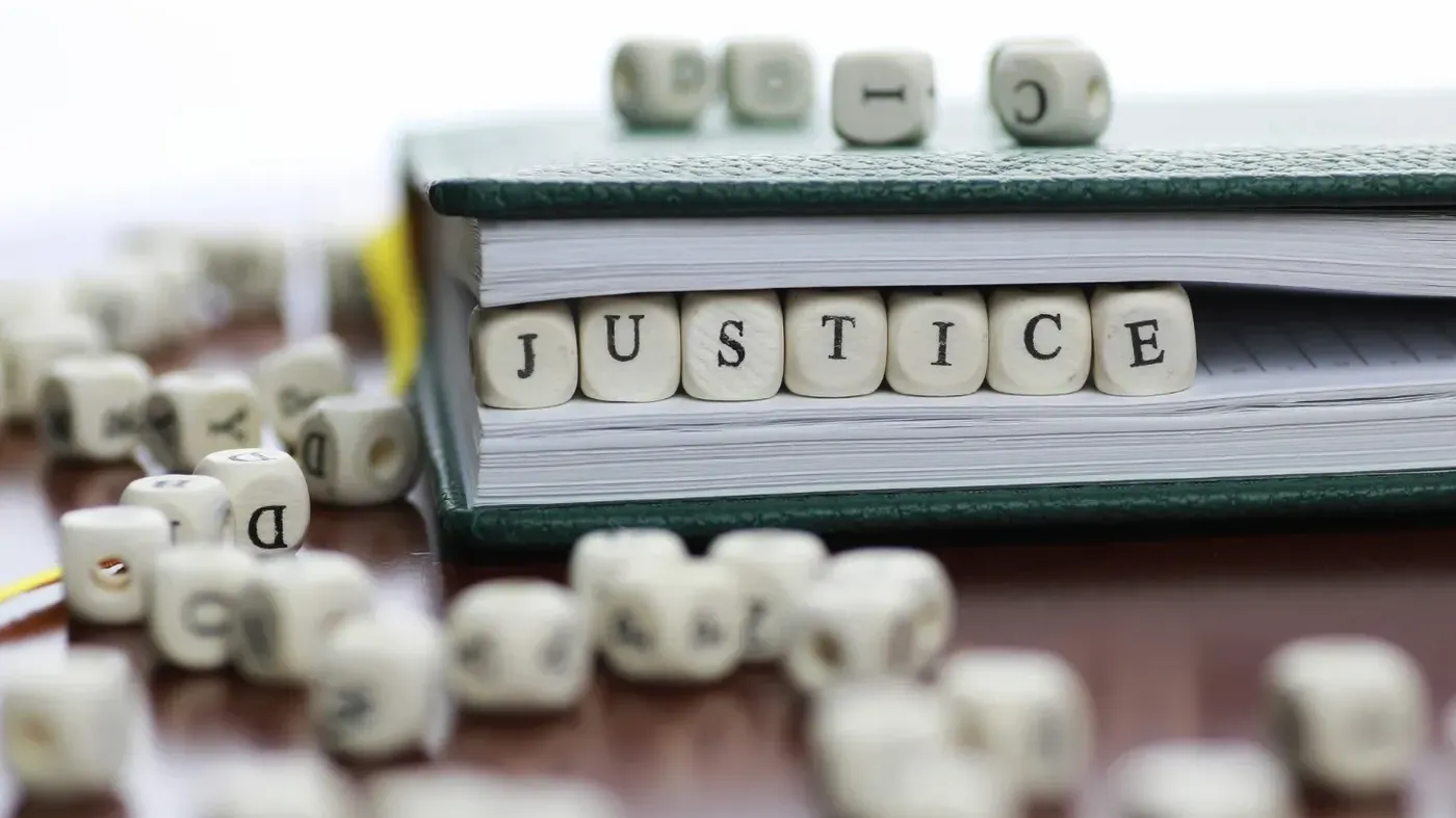 justice blocks in a book