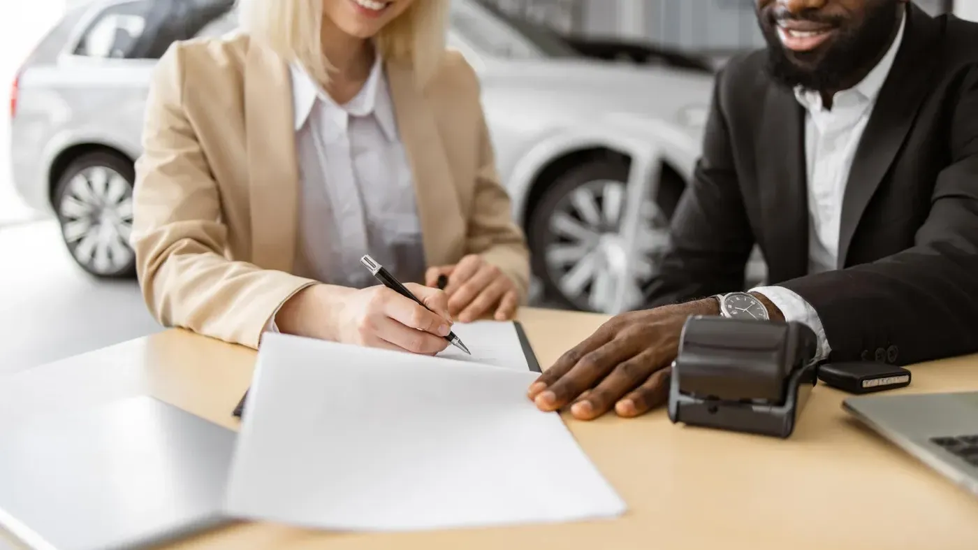 man and woman discussing car insurance