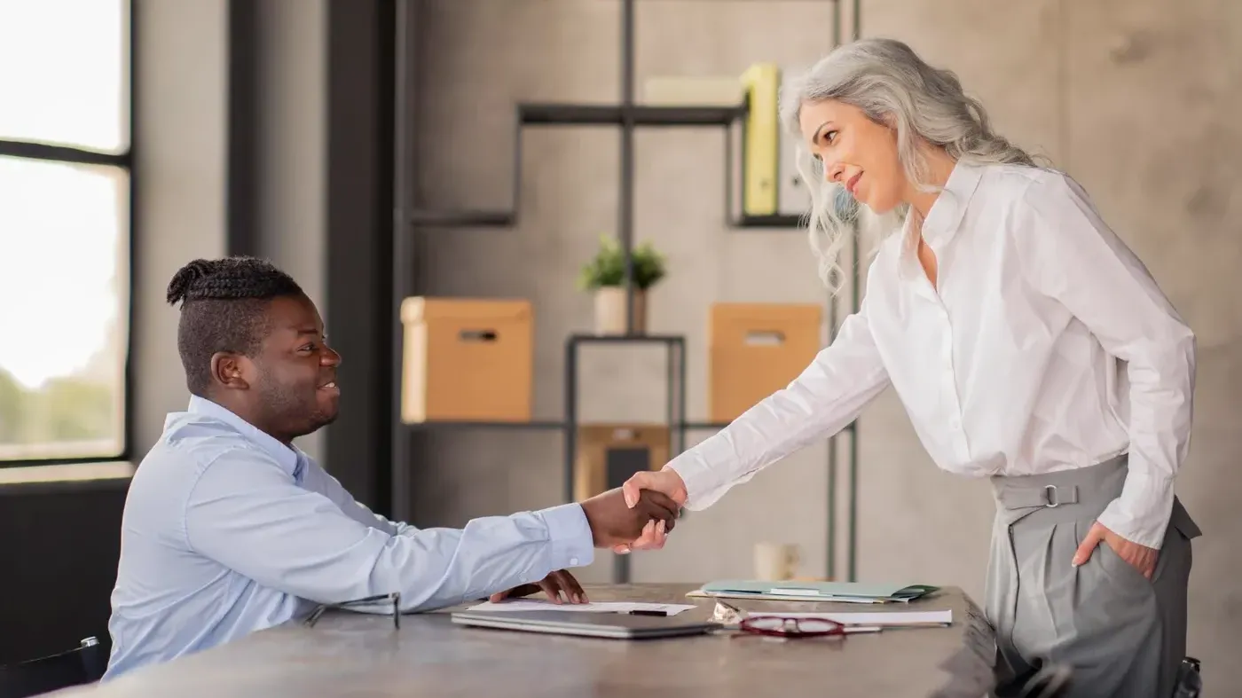 man and woman shaking hands